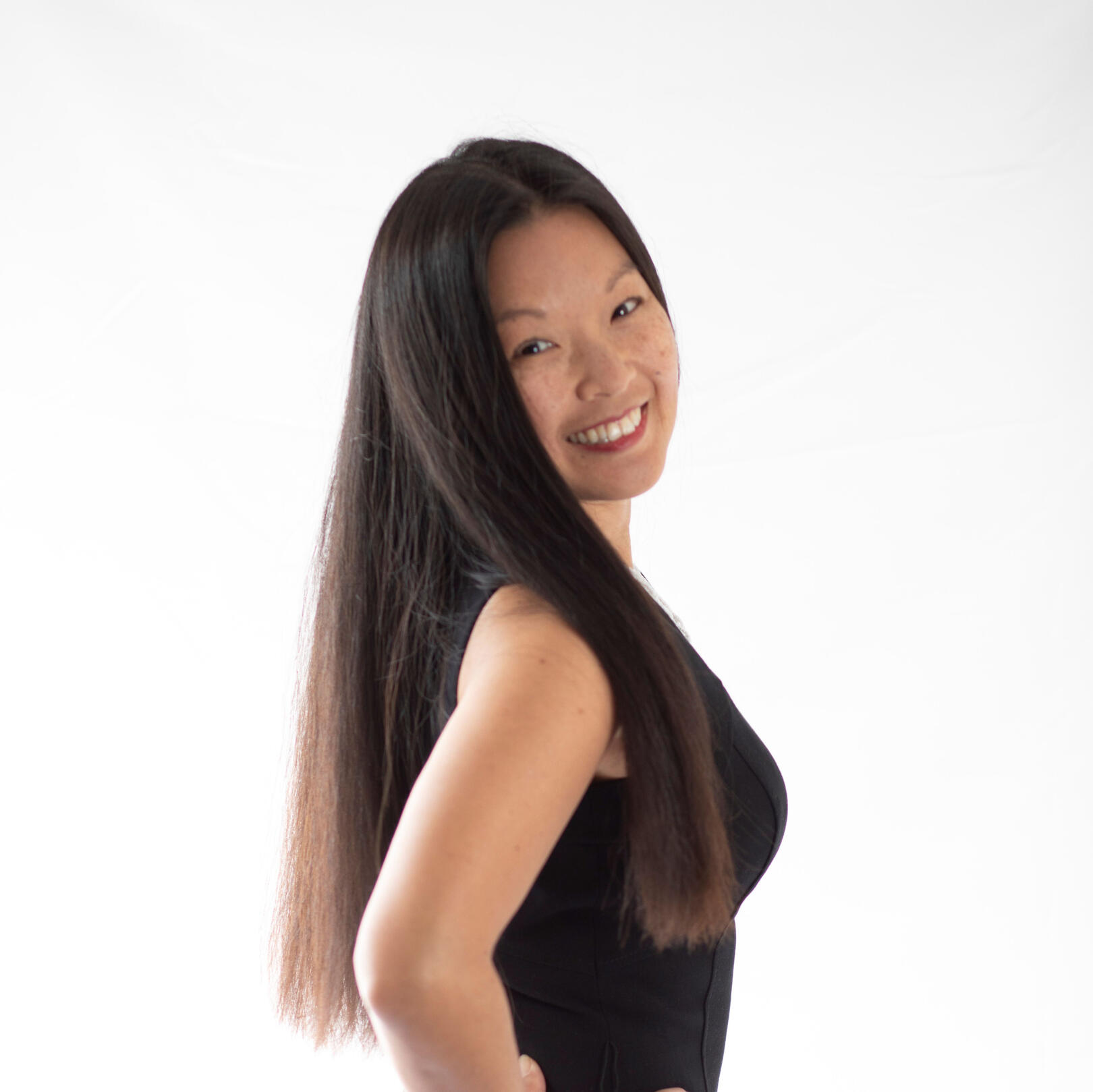 Angie, Founder & CEO women facing right, with face turned towards the front